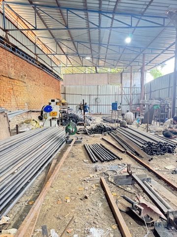 Pipes and steel work on workshop floor